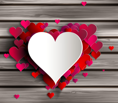 a white heart laid on small red hearts with shack wood background 