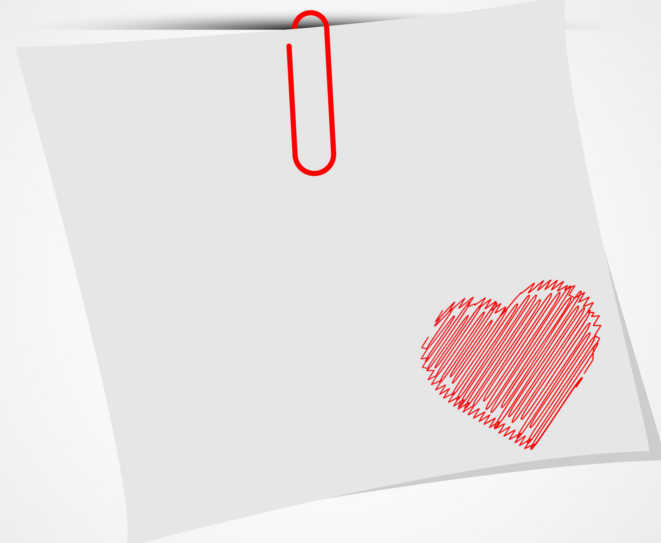 white paper with red clip and a red heart